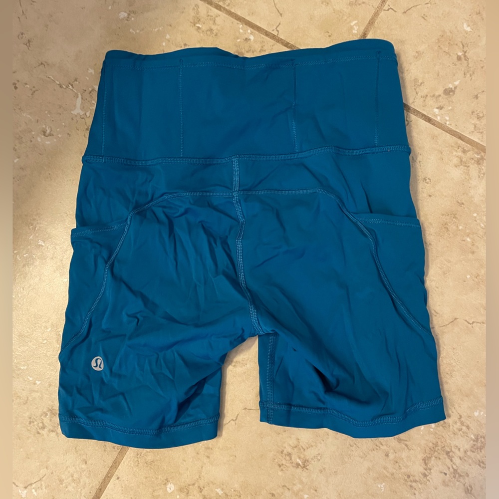 Lululemon dark teal running shorts with side and waist pockets. 5 inch inseam